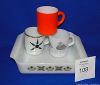 Pan with three mugs stacked