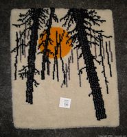 Front view of hooked wall hanging showing full design