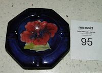 Top view showing cobalt glaze and red Hibiscus design