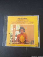 Front view of jewel case with album cover
