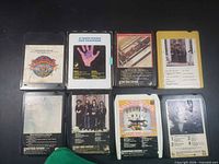 Eight 8-track tapes front view