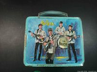Front view showing Beatles graphic and overall wear