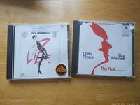 Front view of both CD jewel cases showing cover art