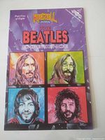Front cover showing title, series logo and portraits of the four Beatles