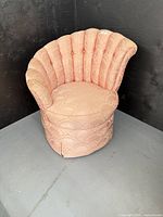 Front angled view of scalloped back chair