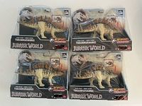 Front view showing all four packaged Tuojiangosaurus figures