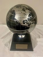 Front view showing United States and pedestal