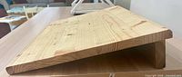 Side view showing slanted solid pine construction