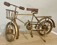 Full view left side of gold bicycle model