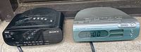 Both Sony Dream Machine clock radios side by side