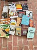 All books laid out on brick surface