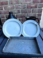 All items grouped showing jug, pitcher, two plates, tray