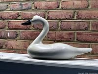 Left-side view of entire swan decoy showing shape and paint condition