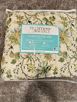 Factory-sealed Waverly Traditions comforter set packaging with label showing contents and sizes