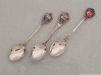 Three 800 silver souvenir spoons showing bowls and handles