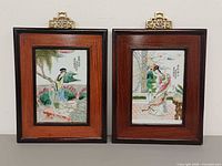 Front view of both framed porcelain plaques