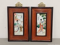 Front view of both framed porcelain plaques