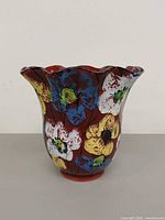 Front view of scalloped-rim floral vase