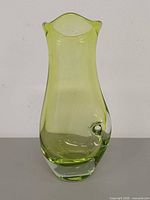 Front view of green art glass vase