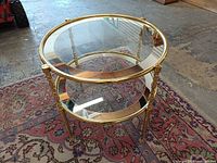 full view of brass and glass side table
