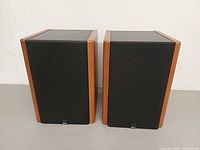 Front view of both MB Quart 220 speakers with grilles attached