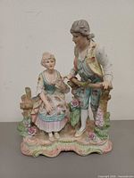 Front view of porcelain couple figurine showing full detail