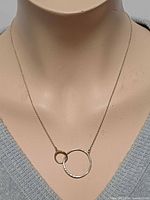 Necklace on mannequin showing pendant orientation and chain length