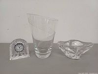 Group view of clock, vase and ashtray