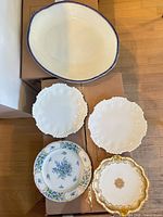 Group shot of five serving pieces on boxes