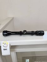 Full view of Bushnell 4x scope showing caps, turret, and integral mount