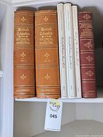 Spine view of all five books on shelf