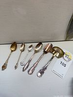 Six assorted spoons laid out side by side