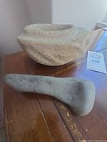 Mortar and pestle side by side on table