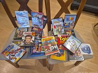 Both chairs with all 24 DVD cases displayed