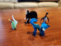 Group shot of four glass animal figurines