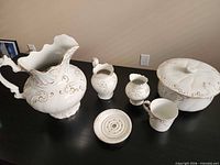 Group shot of all visible pieces: large pitcher, medium pitcher, shaving mug, soap dish with drainer, lidded chamber pot