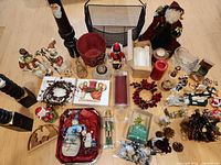 Wide view showing full assortment including posts, basket, cloth Santa, crystal sleigh, candles, figurines
