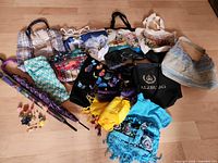 Group shot of all totes, scarves, umbrellas and pins