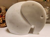 Front view of white stone elephant figurine