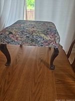 Top view showing floral tapestry upholstery