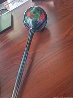 Full view of multicolour glass bulb and stem