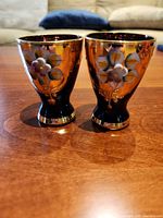 Two Bohemia purple liqueur glasses side by side