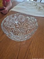 Top angled view of entire cut crystal bowl showing floral and lattice cuts