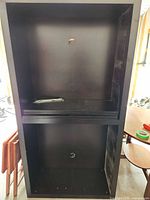full view of black cabinet, open interior, shows size and finish
