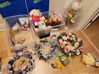 Overview of entire lot including wreaths, bins with assorted décor, large plush bunny