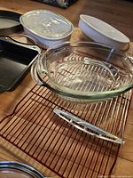 Group of glass, ceramic and metal bakeware with cooling racks