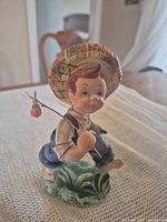 Front view of Lefton fisherman boy figurine