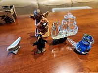 All five figurines grouped on table