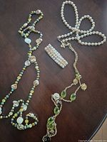 Overview showing all three necklaces and bracelet