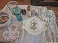 Group view showing bowls, tumblers, plates and figurines